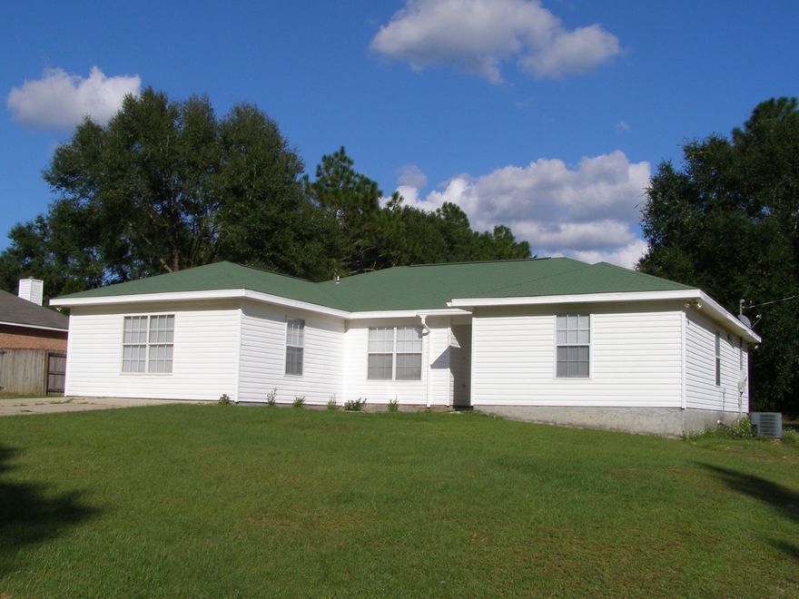 Turn key and ready to move in! Very nice well kept 5 bedroom 3 full baths sitting on a large 3/4 ac corner lot. New carpet in Master Bedroom, family and dining room, tile in Kitchen. 5th bedroom was a nicely converted garage with it's own full bath and a stand up shower and side entry door with a ramp. Perfect mother-n-law quarters. Out back you can enjoy a very large lot with a nice workshop and an additional storage shed. New roof installed in 2015. For peace of mind seller will provide a one year home warranty.
