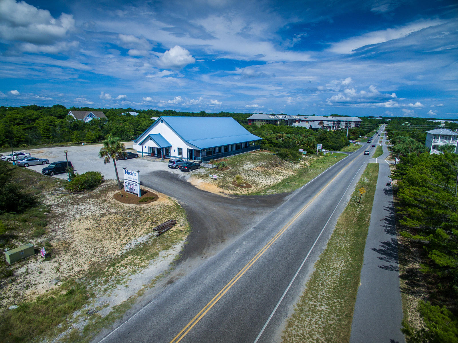Rare and coveted commercial property in Blue Mountain Beach on Scenic Highway 30A! This property and building is located on one of the highest elevations on 30A and in the area of the highest location on the Gulf of Mexico! The parcel is zoned Village Mixed Use which can accommodate up to twelve units per acre. The three contiguous lots provide 300 feet of frontage on Highway 30A (Each lot measures approximately 100' x 200'). The existing building has over 6000 square feet and is currently a restaurant. Call today for more information on this investment opportunity.