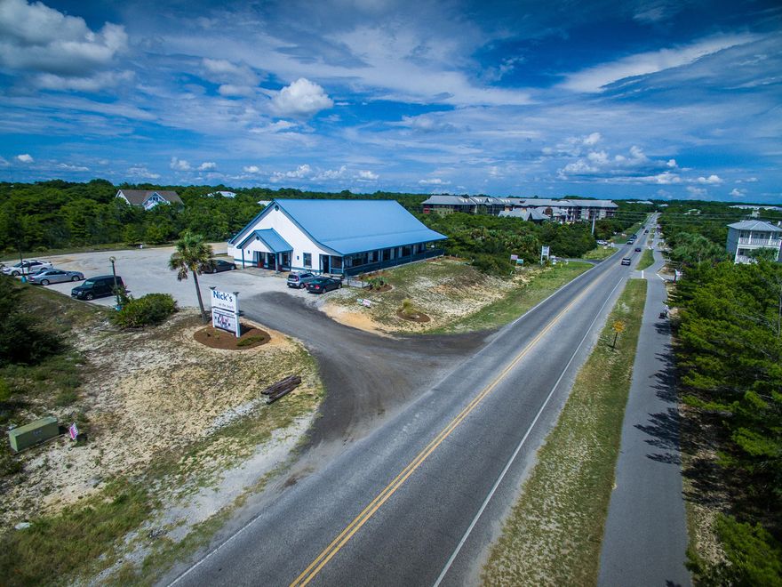 Rare and coveted commercial property in Blue Mountain Beach on Scenic Highway 30A! This property and building is located on one of the highest elevations on 30A and in the area of the highest location on the Gulf of Mexico! The parcel is zoned Village Mixed Use which can accommodate up to twelve units per acre. The three contiguous lots provide 300 feet of frontage on Highway 30A (Each lot measures approximately 100' x 200'). The existing building has over 6000 square feet and is currently a restaurant. Call today for more information on this investment opportunity.
