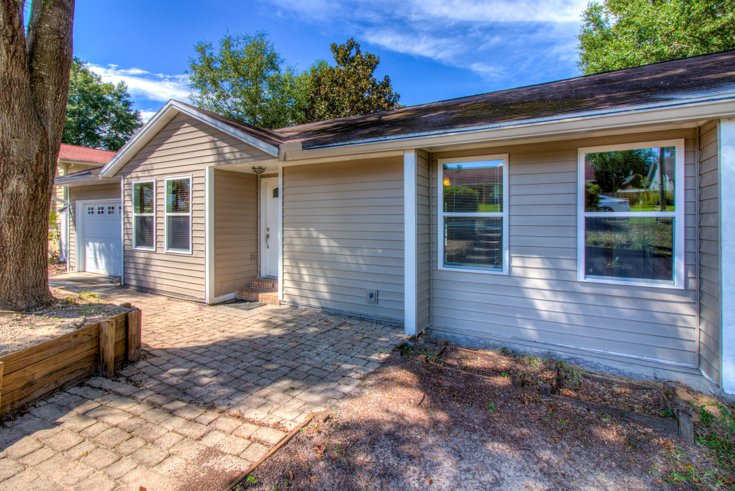 NOW OFFERING A $2000 FLOORING ALLOWANCE FOR LOWER LEVEL UPDATES!This home has plenty of versatile space and features new siding! On the main level, enjoy a generous living room, an updated kitchen with stainless steel appliances and granite countertops, a formal dining room, two bedrooms and two full bathrooms. The lower level, with about 1000 sqft, features another living space, three rooms, a full bathroom, a multi-function space with cabinetry, and storage space. The large and private back yard backs up to a protected area and can be enjoyed either from the 45' deck on the main level or from the patio on the lower level.*Please note that the lower level is configured with three rooms that do not have a second egress point.*