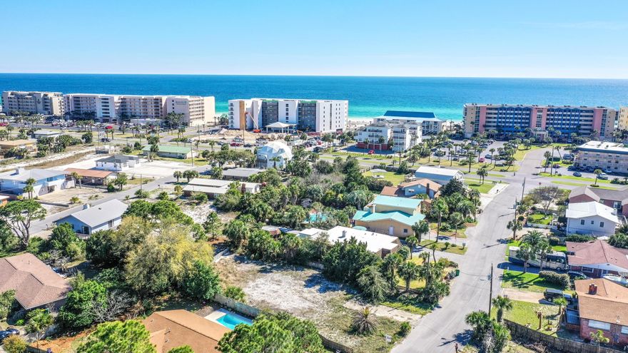 Nice level Okaloosa Island lot just seconds to the beach. Nestled between the Gulf & the Intercostal water way, you will enjoy nice breezes. Ready to build your Coastal Cottage. If you build high enough--you could have partial water views too!