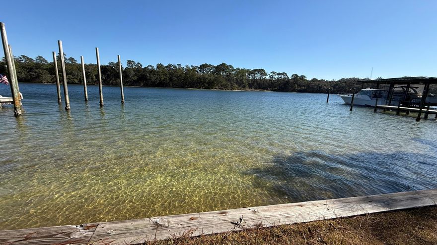 Welcome to your dream waterfront home in the highly sought-after Poquito Bayou community! This beautiful oasis sits on a generous 0.6-acre lot, boasting 107 feet of pristine waterfront and a private dock--perfect for relaxing in your own backyard. Step inside to soaring cathedral ceilings and a sunroom that offers breathtaking, panoramic views of the bayou, creating an atmosphere of peace and tranquility.Strategically located near Eglin Air Force Base, top-rated schools, shopping, banking, and all the conveniences you need for everyday living, this home perfectly blends natural beauty and convenience. Whether you're entertaining guests or simply unwinding, this exceptional property invites you to experience the very best of waterfront living in Shalimar, Florida.