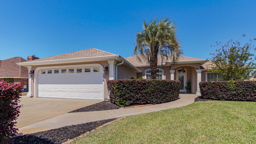 This beautifully maintained home in Grand Lagoon Shores offers the perfect blend of space, comfort, and coastal convenience. Located just half a mile from the beach and minutes from the Navy base, it features four bedrooms, three full bathrooms, and a flexible bonus room that can be used as a nursery or office. One of the bedrooms includes its own en-suite bathroom, making it ideal for guests or multi-generational living.The exterior has been freshly painted in a neutral color, giving the home a crisp, updated look. Inside, the open concept layout creates a natural flow between the family room, dining area, breakfast nook, and a cozy den. A sitting area flex space off the den now features new carpet, adding comfort and versatility. The kitchen has been upgraded with new quartz countertops and updated hardware, offering a stylish and functional space for everyday living.

High ceilings, arched entryways, crown molding, built-ins, and a surround sound system inside and out enhance the home's overall appeal. Additional upgrades include a new HVAC system installed in 2022 and stainless steel kitchen appliances that are just one year old. The covered back patio overlooks a fully fenced yard with plenty of room for outdoor activities, and two outdoor showers make cleanup easy after a day at the beach.

With professional landscaping and impressive curb appeal, this home stands out in one of Panama City Beach's most desirable neighborhoods.