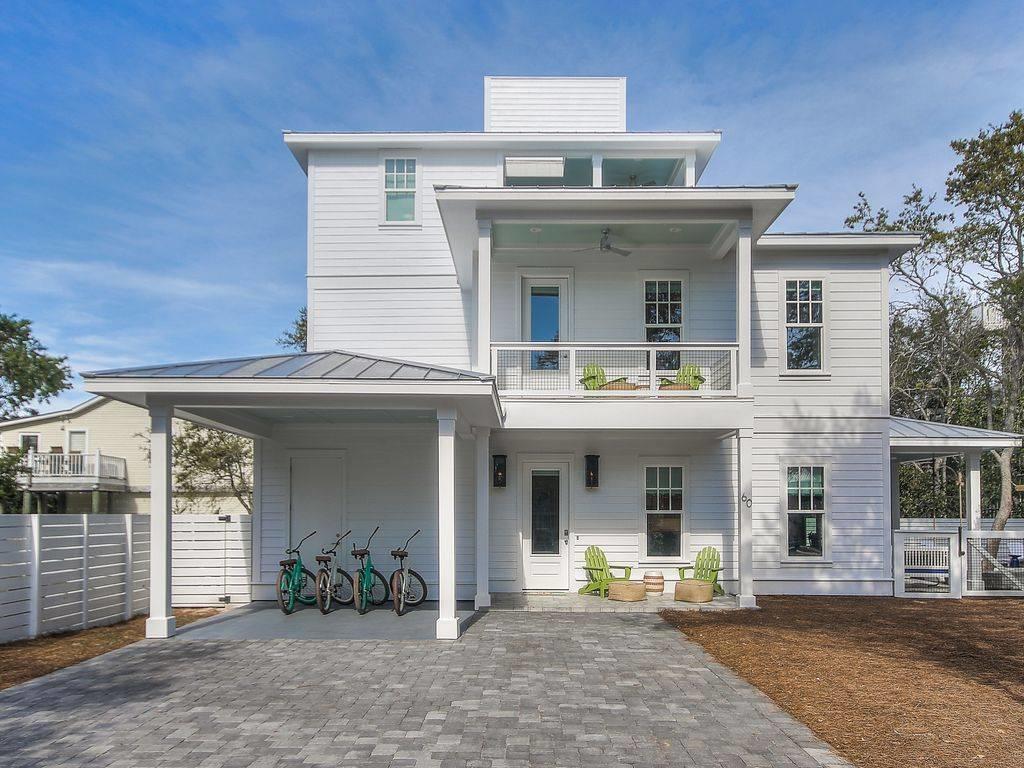 This custom home located in a quaint neighborhood of Blue Mountain Beach which is characterized by both lavish private residences & coastal dune lakes, making it one of a kind. Enjoy your privacy but also walk to several local dining hot spots and shops. There are gorgeous wood floors throughout the home & custom tile bathrooms. The well appointed kitchen features a 36'' Viking commercial range oven, Viking Refrigerator & Dishwasher & a Viking convection microwave. The vent hood is detailed with shiplap and pecky cypress. The home has tankless hot water heaters and impact glass windows and doors throughout. The private pool is upgraded with a heater and chiller to make it enjoyable in all types of weather.