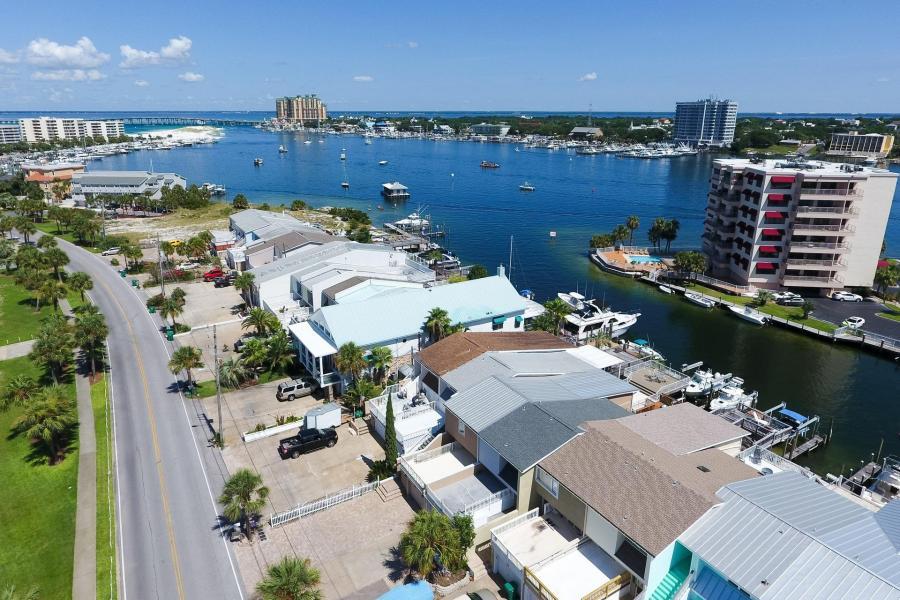 This multi-level town home is great for living the Holiday Isle lifestyle with the boat slip on the canal on minutes from the Destin harbor and Crab Island. The kitchen has granite counter tops and stainless appliances. Tile floors with new carpet just installed. Three bedrooms with a study and master bedroom has a view of the canal and own private deck on lower level. Master bath has whirlpool tub, separate shower, and double vanities. Plantation shutters on windows.2232 SF of living space per plans and county records show 2154 SF. Buyer to confirm all dimensions and square footage. Sellers Disclosure under documents tab.