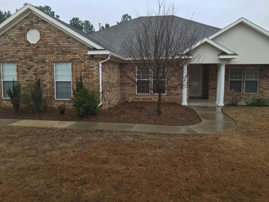 The home is located on a spacious corner lot in Windswept Estates. This community is family oriented and has golf course and community pool. The home has a gas cooktop and built in wall oven and microwave. The master bedroom is spacious with a huge bath. It is a split plan to give your family plenty of privacy. The screened porch looks out onto a huge back yard with iron fence. Seller will consider owner financing and will give a carpet/decorating allowance with acceptable offer.