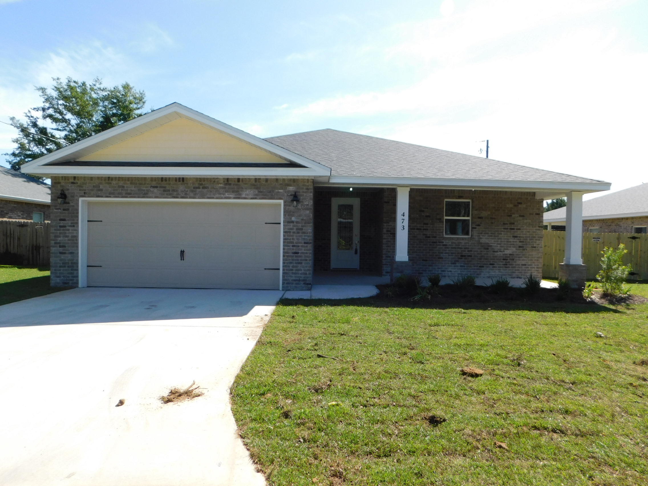 Home is complete! Builder pays MOST CLOSING COSTS on this home with full price offer! Ask for details. SAVE MORE BY BUYING NEW! LOWER INSURANCE AND LOWER UTILITY BILLS! Be the FIRST to Live in this Beautiful 3/2/2 CRAFTSMAN STYLE Home with Upgrades Galore! Gorgeous Tile throughout the entire Living Area, Kitchen, Hallway, Laundry Room and Baths! Carpet in the bedrooms. The Kitchen has abundant Granite Counters, A Breakfast Bar, Wood Cabinets, Stainless Appliances (including a side-by-side Refrigerator!) and a pantry. Covered Lanai! Sprinkler System and Lawn Pump included! Features May Differ from photos of this completed home. Please verify features that are important to Buyer.