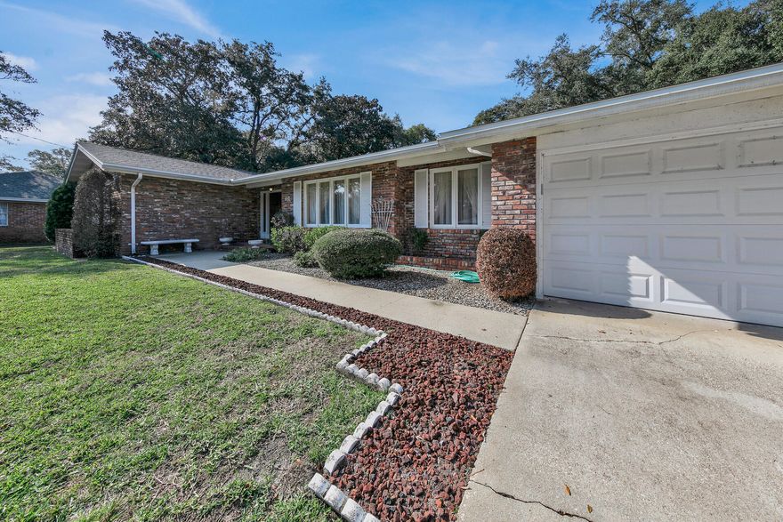 Located close to 3 bases, Eglin, Hurlburt and Duke Field. All brick one level 1960's home, well manicured large front and back yard, nestled towards the end of a cul-de-sac. New Roof 2022, gas hot water heater December 2022 hvac  2012 inside and out. Oversized 2-garage, enters into a large utility room with pantry. Large eat-in kitchen with nook with bay window overlooking the backyard.  Enter the home through a large foyer that overlooks a large formal living room combined with a formal dining room, that flows through the kitchen and nook and into the large paneled family room.  The family room boasts a brick accent wall with gas burning fireplace. Four large bedrooms and closets and a primary bedroom with sold brick accent wall. Primary bathroom