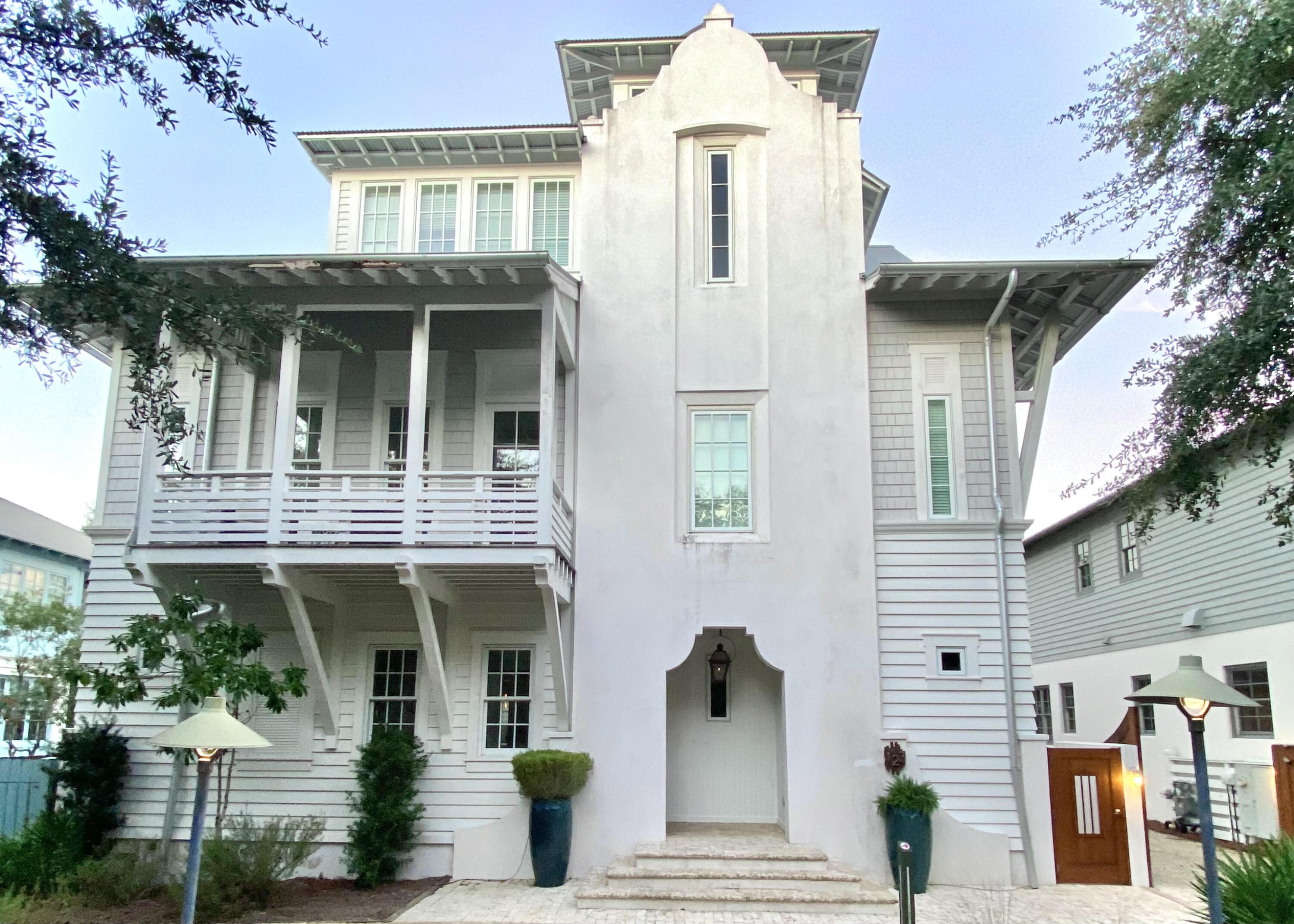 'BAREFOOT' house offers PRIVACY PLUS OPPORTUNITY!! FABULOUS POOL & COURTYARD make this home a wonderful RENTAL PROPERTY & has the possible 'UP SIDE' of room in back to ADD A 2-CAR GARAGE & CARRIAGE HOUSE. Custom designed 5BR/5.5 BA 4000+sf home has mahogany highlights, white oak floors, & ELEVATOR. MASTER SUITE on 1st FLOOR has INCREDIBLE BATH, closets & French doors to courtyard. CHEF'S KITCHEN is open to Living/dining area has ROOM FOR THE ENTIRE FAMILY to gather off of courtyard & pool. HUGE pantry w/ work space & laundry. OPEN STAIRS lead to DEN/MEDIA area on 2nd floor w/ 2 'Master suites' & a BUNK ROOM. Both guest suites open onto balcony overlooking POOL area. FLOATING stairs to 3rd floor w/ another 'Master' BR & kid's bunk area. Spiral stairs lead to viewing tower for rooftop views.