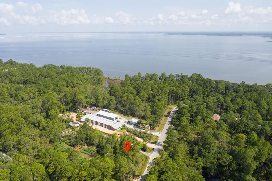 If you are wanting to have your own space with no HOA restrictions, yet still be close to 30A and all that it offers, you need to check out this large wooded 1/2 acre lot in Historic Pt Washington! Really special setting across from Eden Garden State Park. No HOA and NO buildout times with public utilities available. There is a current survey available. Closest public boat ramp is at end of Hwy 395 North.