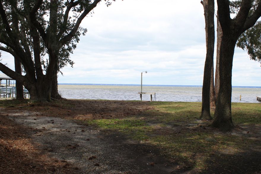 WaterFront Lot!! Build your Dream Home on the 101 Feet of Choctawhatchee Bay in Miramar Beach! This lot has a beautiful view is located on Crest Drive in a quiet neighborhood located on a cul-de-sac. Lot includes a seawall and a cleaning table for your catch of the day. Drive is minutes from Silver Sands Outlet Mall, Destin Commons, Baytowne Wharf,and the Beach.