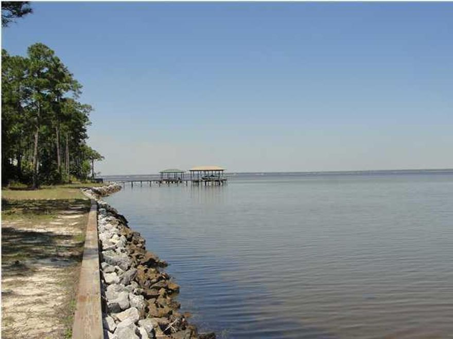 Gorgeous .69 acre lot with 100 Feet on the Bay. The lot has recently been bush hogged. Build your Bayfront dream home on this large lot located in a great neighborhood. Driftwood Estate feature many amenities including playground, picnic area, and more. Located closed to Sacred Heart Hospital, Grand Boulevard Shopping Center, Sandestin Golf & Beach Resort, Baytowne, restaurants, & just a short drive to the beach. Don't miss this amazing opportunity to own a Bayfront lot at a great price. A must see!!!