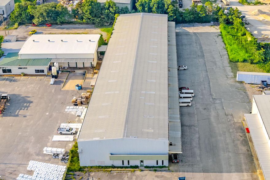 Welcome to 33 NW Jet Drive - a versatile industrial property built for functionality and efficiency. This well-maintained facility features four oversized bay doors, each measuring 11'11' wide by 16'4' tall, providing easy access for trucks, equipment, or large inventory. Inside, the building offers an expansive 31'2' ceiling height, with 28'4' to the tallest eave, ideal for high-clearance storage, racking systems, or specialized machinery.In addition to the warehouse space, the property includes a small, built-out office area complete with two bathrooms, perfect for administrative operations or a break area for staff. Don't miss this rare opportunity!