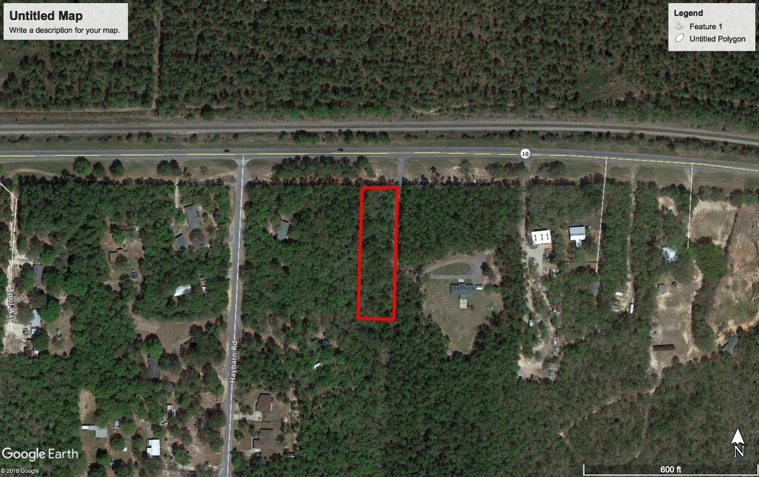 Beautiful hardwoods, large level homesite with highway frontage! Possible commercial use. The county will allow agricultural related business in Agricultural zoning on Hwy 90.