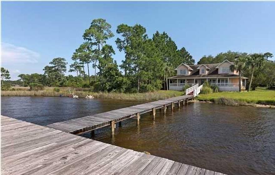 LARGE HOME ON BEAUTIFUL LAKE POWELL. OPEN FLOOR PLAN ON BOTH FLOORS. LARGE BEDROOMS, UNIQUE DECOR, APPLIANCES, TWO A/C UNITS, GORGEOUS MATURE LIVE OAKS ON THE PROPERTY. BOAT DOCK ALREADY IN PLACE FOR LAKEFRONT LIVING. LARGE FRONT PORCH PROVIDES THE PERFECT VIEW OF THE LAKE. JUST OVER A MILE AWAY TO THE WORLD'S MOST BEAUTIFUL BEACHES AND MINUTES AWAY FROM 30A AS WELL AS ALL THE SHOPPING, RESTAURANTS, AND FUN AT PIER PARK, THE LOCATION IS UNBEATABLE. ENJOY THE RELAXING LAKEFRONT LIFESTYLE WHILE HAVING THE BEACH FUN AND SHOPPING A SHORT DISTANCE AWAY.