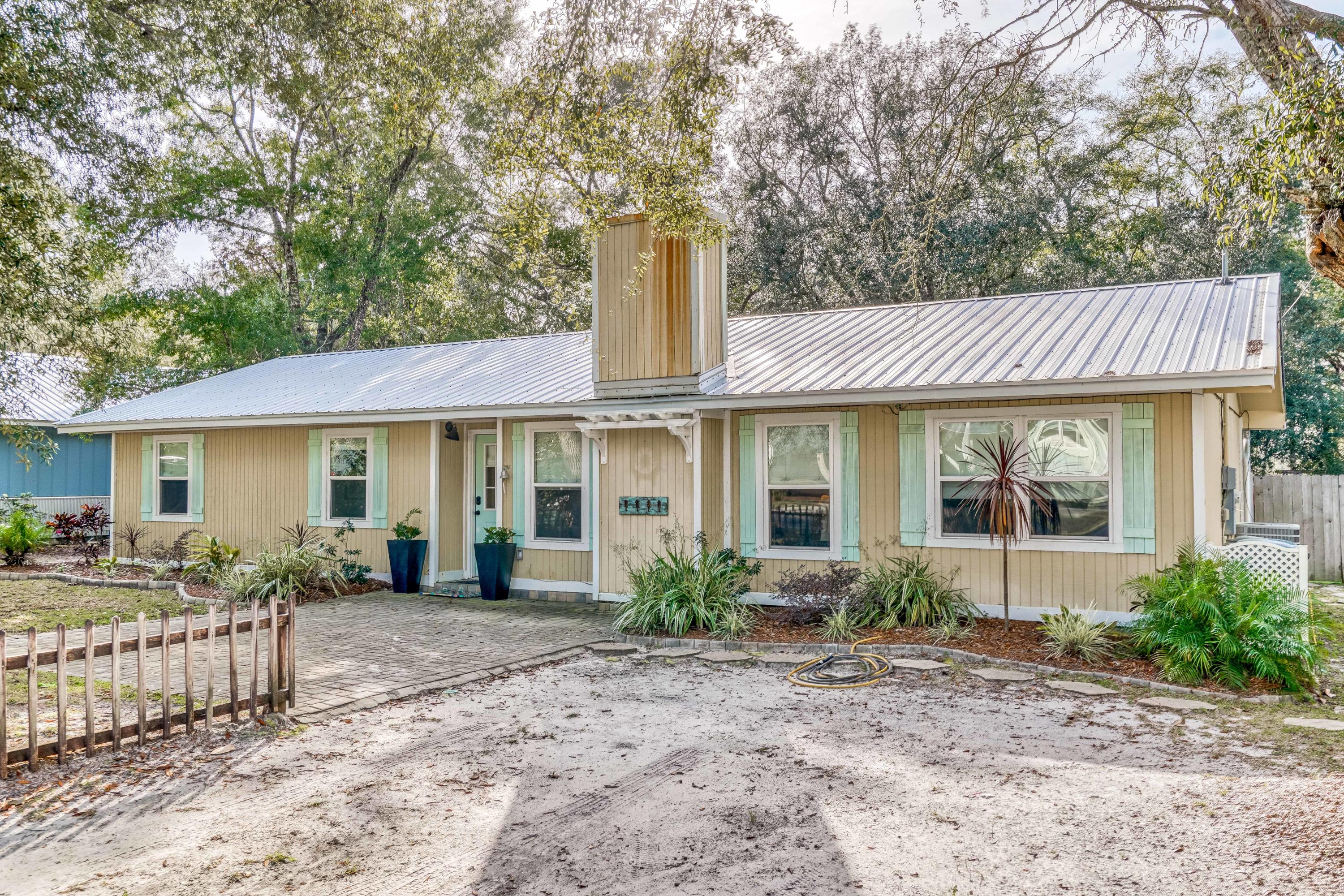 Charming opportunity in the popular neighborhood of Point Washington. Chic one level cottage with southern flair. A generous backyard with lofty oak trees has room for a pool or additional sq footage. This 3 bedroom, 2 bath house has an oversized bonus room with built in shelving that could be used for an exercise room, a 4th bedroom, a child's playroom, an office, a craft room or storage. Oversized master suite with vaulted ceiling and two closets. The inviting living room features a stone gas fireplace, bead-board ceiling and white plaster walls opening up to the dining room and kitchen allowing for ample entertaining. The kitchen has upgraded countertops and stainless steel appliances. Point Washington, a great place to call home, is only minutes to Grayton Beach and all of 30A. has to offer.