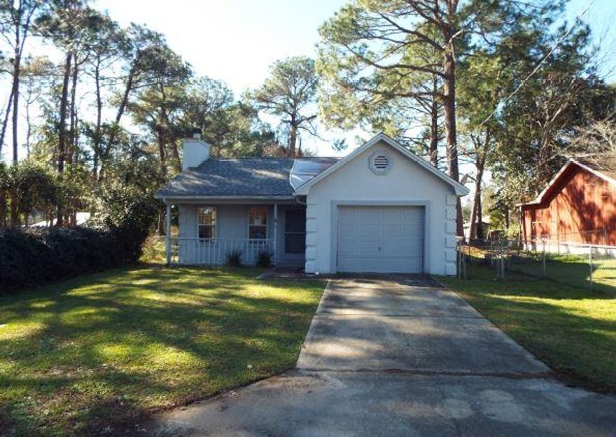 Cute cottage with front porch and attached 1 car garage. It is located in Okaloosa County and offers 1,213 square feet of living space with 3 bedrooms and 2 full bathrooms. The kitchen is spacious with plenty of cabinet and counter space. The living room has a wood burning fireplace to cozy up to. Enclosed sun room on the rear of home is great for entertaining. Restaurants, shopping, and parks within 4 miles.This property is bank owned. It is sold in as-is condition without repairs or warranty. Buyer is responsible for verifying all information contained in this listing.