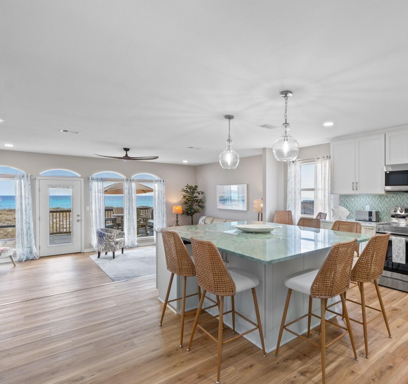 Remodeled from Top to Bottom. This Luxury Beach home offers 3 oversized Bedrooms and 3 all new Full Baths. The open living and kitchen area fronts the Gulf. Kitchen is equipped with new smart Samsung appliances, custom soft close cabinetry, 6' x 7' center isle with seating for 8, and beautiful eye catching quartz counter tops. Kitchen is outfitted for 12. Living room is comfortably furnished, offers full view windows looking out to the beach. Living area extends onto the Gulf front balcony. The first level has a full sized bath and laundry room and an oversized bedroom with a king bed. Top floor has a full sized bath with shower/tub and a bedroom with 2 queen beds. The Gulf front primary bedroom furnished with a king sized bed, has its own balcony, a primary bath with double vanity and walk in shower with dual shower heads to include a rain shower. Enjoy water views from every window in this home. Take advantage of the outdoors from any one of the 3 balconies. No HOA. This high end luxury home is fully equipped and ready for use as a second home or an income producing vacation rental. This professionally designed and decorated home will convey fully furnished, move-in and toothbrush ready. Just start enjoying the views and making memories from the first moment you walk through the door. Schedule an appointment to view, you won't be disappointed.