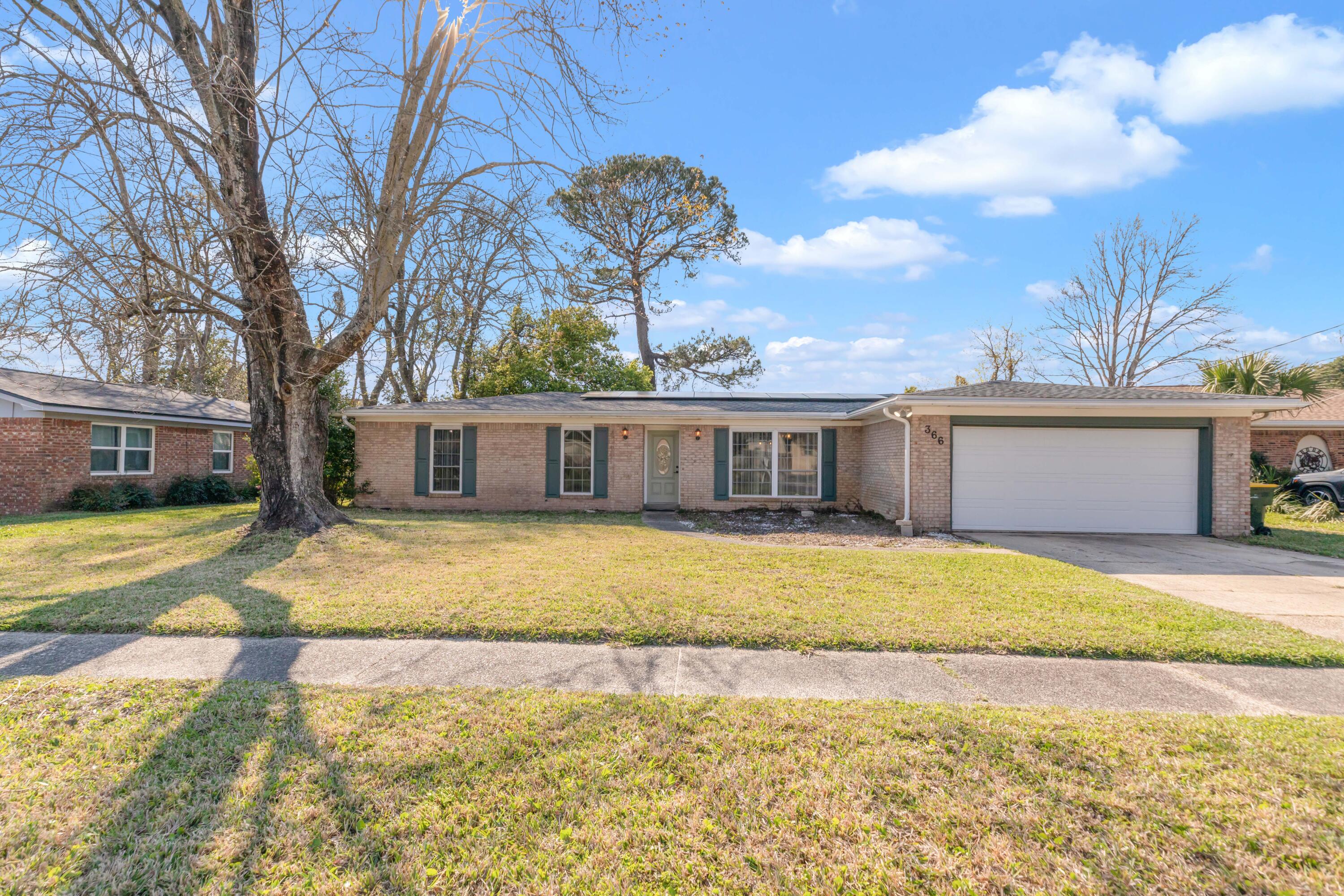 Don't miss your chance to own this beautiful brick- centrally located home. Exterior of home features a neighborhood with sidewalks and roads that dead end so no through traffic. Roof was replaced in 2022 and solar panels were installed in 2023. They will convey with the home PAID off. Windows were updated in 2016, home was rewired to copper, new insulated garage door 2023, HVAC 2020 and water heater 2019. Step inside your home where the flooring has been updated (no carpet), new fixtures, fresh paint and large wood burning fireplace. This home offers great storage and space in and outside the home. The back yard is fully fenced. This home has no HOA.