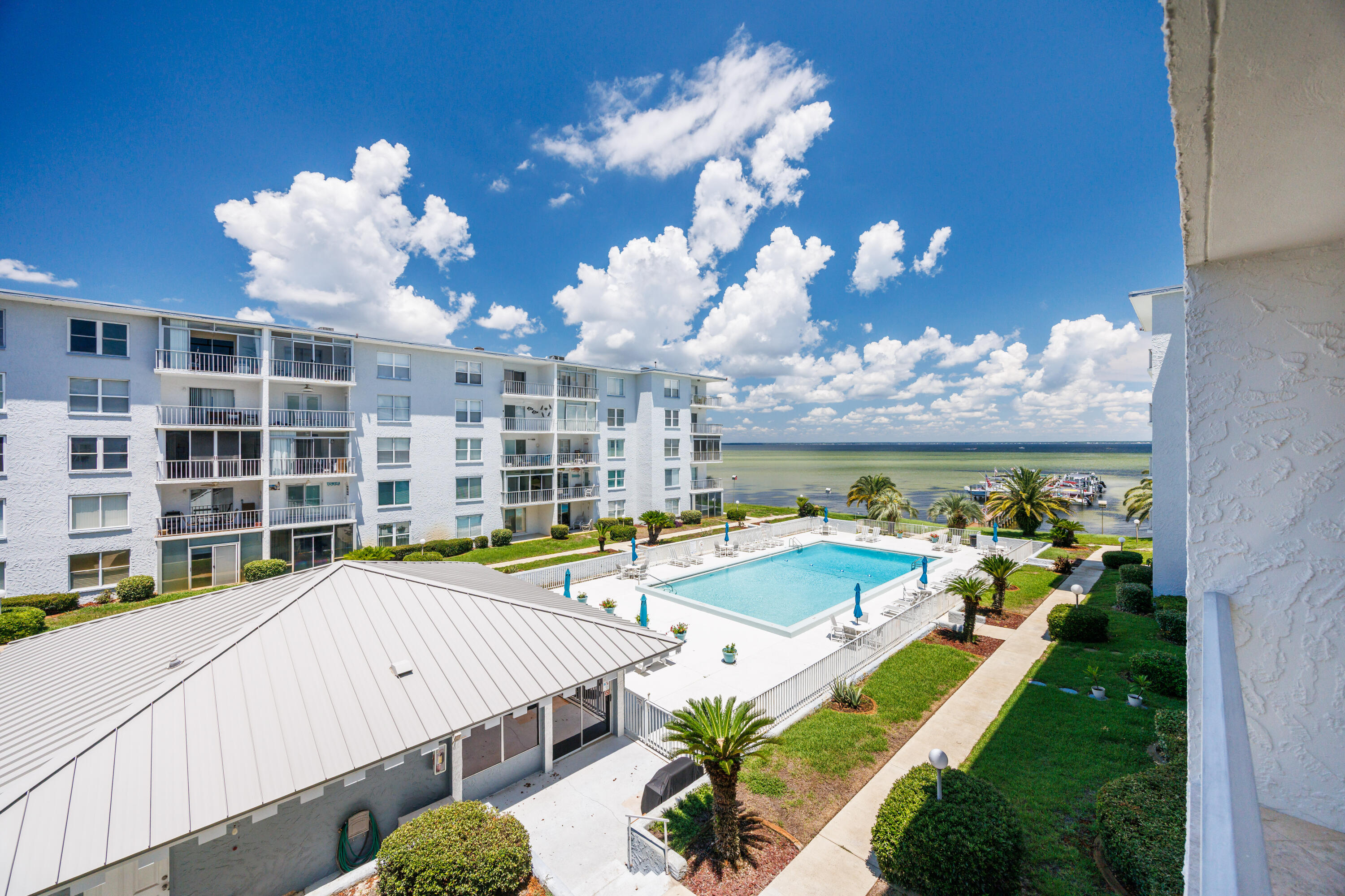 Immaculate, fully renovated condo with breathtaking Choctawhatchee Bay views. Features include a designer KitchenCraft kitchen with Bosch stainless appliances, granite counters, wine rack, hand-blown glass pendants, and travertine flooring throughout. Updated bathrooms, crown molding, and designer lighting add luxury touches. Watch dolphins from your balcony or relax at the heated pool and renovated docks. Sold fully furnished and move-in ready! New HVAC (2024) and water heater (2025). A turnkey waterfront gem!