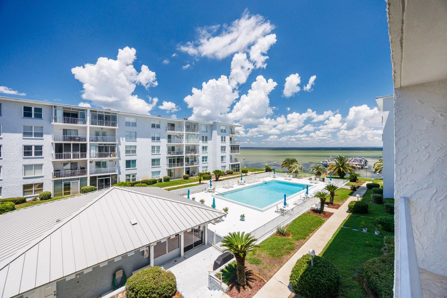Immaculate, fully renovated condo with breathtaking Choctawhatchee Bay views. Features include a designer KitchenCraft kitchen with Bosch stainless appliances, granite counters, wine rack, hand-blown glass pendants, and travertine flooring throughout. Updated bathrooms, crown molding, and designer lighting add luxury touches. Watch dolphins from your balcony or relax at the heated pool and renovated docks. Sold fully furnished and move-in ready! New HVAC (2024) and water heater (2025). A turnkey waterfront gem!