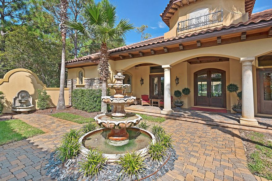 NEW PRICE! While some homes are at their best as either a private retreat or a place to entertain family & friends, this home shines as both. Carefully sited on one of Burnt Pine's most private lots with a view of the 8th hole, this home is a secluded sanctuary in one of the Southeast's most desirable neighborhoods. The Master Suite; the cloistered courtyard with splashing fountains; provide the possibility of time spent without the interruptions of day-to-day life. But throw open the front gate, the lavish entrance doors and the disappearing glass sliders to the pool patio & outdoor kitchen, and bring the party to your place. The ultra-cool Martini Bar, private wine cellar, generously sized kitchen & formal dining room that can seat 1