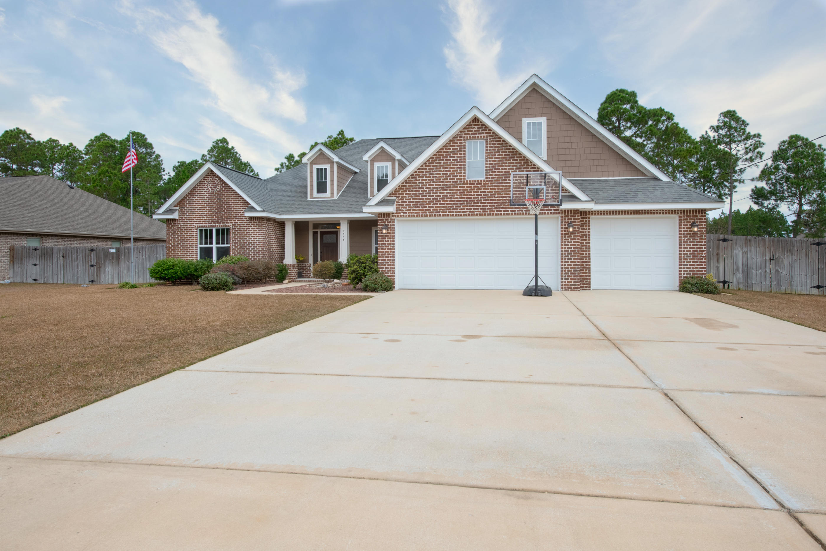 Don't miss this 5 bedroom, 3 bathroom, 3 car garage, craftsman BEAUTY in Holley By The Sea. Sitting on nearly half an acre of land, this Avant-Price built home is only 5 years young and looking better than new! Some notable features are the wood look tile throughout the main living areas and wet areas, the custom solid wood cabinetry, granite countertops, stainless appliances, 10ft ceilings with crown molding, two large walk in closets in the master, seperate vanities, walk in tile shower with THREE shower heads, soaking tub, oil rubbed bronze fixtures, a wide open floor plan and that's just on the inside! Outside you can enjoy the large covered lanai with a HUGE grilling and entertaining area as well as a fireplace! Schedule your showing today!BACK ON MARKET, NO FAULT OF SELLER.