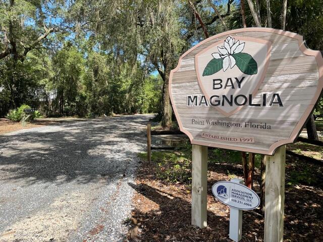 Over 1/2 acre restricted, beautiful, wooded home site appears to be in Flood Zone 'X' in beautiful Bay Magnolia located in Historic Pt Washington. Only a few minutes to Beaches, Bay access and the many amenities in South Walton County. This Bay front destination features a common area beach/dock/pier within a few steps of this prime site. Minimal HOA fees. No buildout time-to be confirmed with HOA.