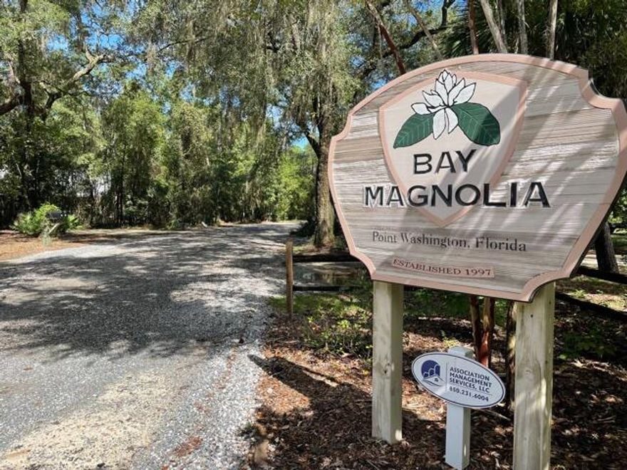Over 1/2 acre restricted,  beautiful, wooded home site appears to be in Flood Zone 'X' in beautiful Bay Magnolia located in Historic Pt Washington. Only a few minutes to Beaches, Bay access and the many amenities in South Walton County. This Bay front destination features a common area beach/dock/pier within a few steps of this prime site. Minimal HOA fees. No buildout time-to be confirmed with HOA.
