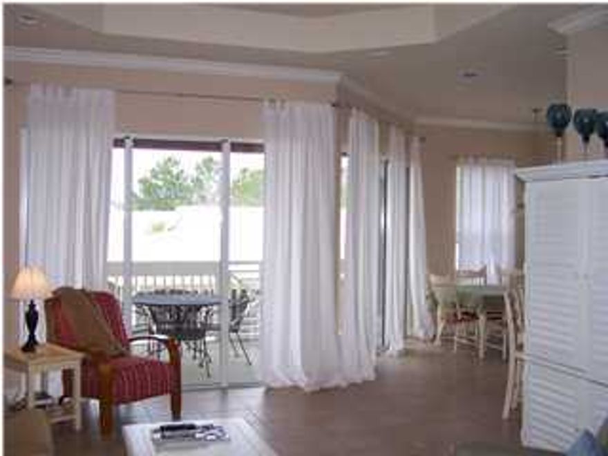 This beautifully furnished 2 bedroom 2 bath has a large covered balcony that over looks Crystal Lake with it's gazebo and water sprays. It has a great open floor plan with granite counter tops in the kitchen and stainless appliances. Lots of windows and light make this a very appealing place.