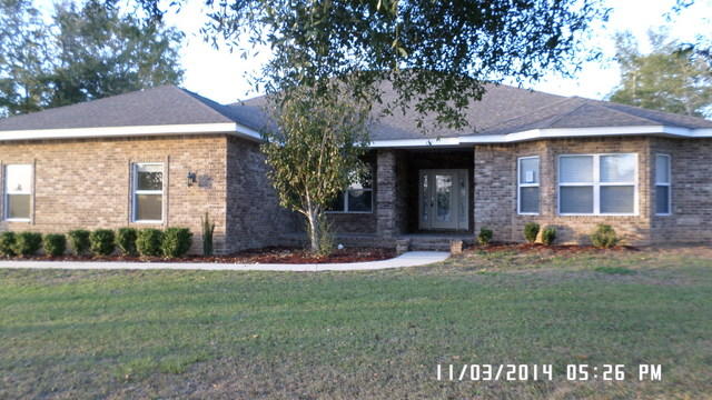 Located in the bustling Carnegie Hills Subdivision, this custom built home was built in 2009 and is approx 2400 sf. Home has 3 large bedrooms, and 2 large bathrooms. Master bath has a large walk in closet, double sinks and large tiled shower. Full bath is shared by both additional bedrooms. You will find double trayed and crown molded ceilings throughout, recessed lights, hanging lights, hardwood floors, tile and carpet. The kitchen is full of cabinets and has an oversized kitchen island with bar top for additional eating space. So much of this home makes this property a must see and must have. All brick exterior and a covered lanai the spans the entire width of the back of the home. Priced competitively in this growing neighborhood. Call today as this will not last!