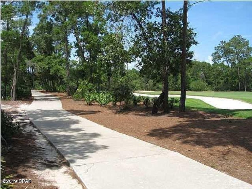 Premium lot measuring approximately half an acre and backing up to the 18th green of Sharks Tooth Golf Course. This lot has excellent views to the 18th fairway and is a very short golf cart ride to the amazing Shark's Tooth Clubhouse. Wild Heron is a 734 acre subdivision with the Award Winning Shark's Tooth golf Course designed by Greg Norman, tennis courts, Prospect Point Pool and hot tub overlooking Lake Powell, a Community Dock and Boat House with kayaks and canoes, Fitness Center, Outdoor Pavilion, Fire Ring and Playground. Wild Heron is just a short drive to the white sandy beaches of the Emerald Coast and the Gulf of Mexico. Plenty of shopping, dining, entertainment and the Panama City Beach Airport are just minutes away.