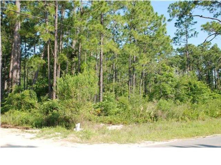 MOTIVATED SELLER! Located in growing area of North Santa Rosa Beach. This property is approximately .286 of an acre (100 X 125) with 100 feet of frontage on Indian Woman Rd. which is a paved road, and 125 feet on E. Ann St. This is two 50 X 125 lots! Ideal corner location for your new home. Lot appears to be high and dry. There is public water and sewer available on Indian Woman Rd. and other utilities like electric, phone, & cable are also available. Lot appears to be high and dry; however, buyer to verify all dimensions and other pertinent information. You are just 1.5 miles to the Cessna Landing Park which offers a boat launch, fishing pier, picnic pavilions, basketball court, playground & restrooms. A great spot to head out to the Bay for a day of fishing or other family fun.