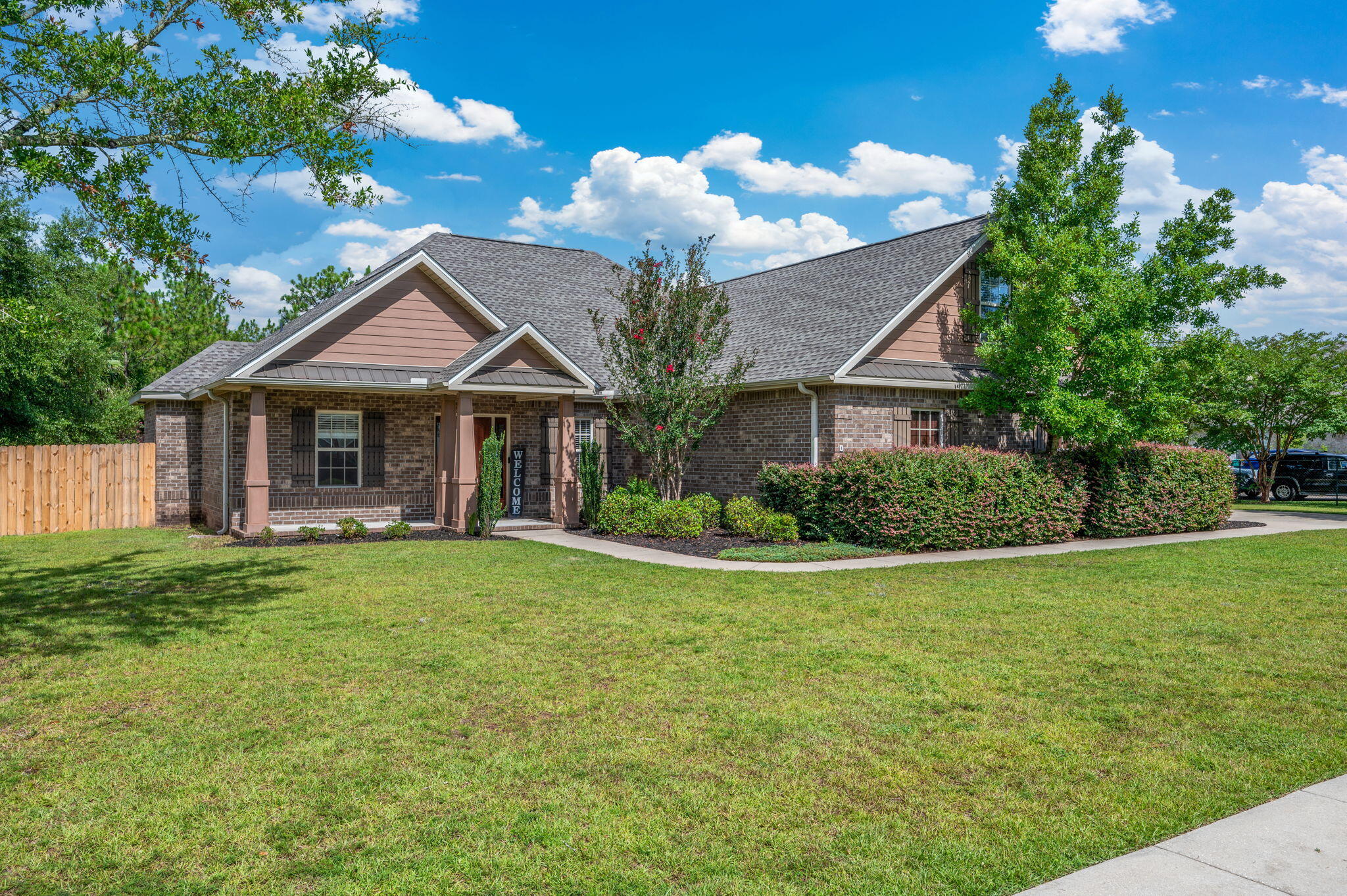 This beauty offers the ideal blend of comfort, function, and outdoor fun. When you enter into the home you are greeted into a large livingroom that flows seamlessly into the kitchen. Offering granite countertops, stainless steel appliances, a breakfast bar with seating, and a tongue-and-groove ceiling accent, the kitchen will make cooking and entertaining feel effortless. The generously sized primary suite features a double vanity, private water closet, and a beautifully tiled in shower. Two additional large bedrooms are located on the main level, while a private upstairs bedroom offers a perfect setup for guests, teens, or a quiet home office. Out back, unwind under your covered porch or take a dip in the sparkling in-ground pool, all within the privacy of a fully fenced backyard.