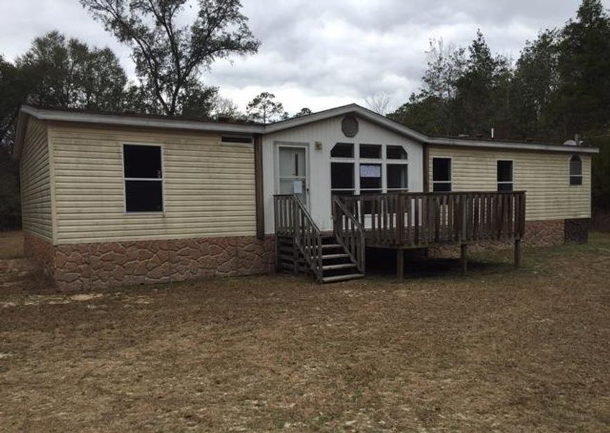 REO- Quaint 3 Bed, 2 Bath home situated on 3 Acres! Featuring an Open Concept Layout, Vaulted Ceilings a spacious Eat-In-Kitchen & a HUGE Work Shed! Don't miss out on this Amazing Opportunity to own your own piece of paradise! This property is UI (Uninsurable). Property is estimated to need more than $5000 in repairs by FHA Appraiser making it NOT eligible for a standard FHA loan. AVAILABLE TO ALL BIDDERS!! Home is being sold ''AS IS''. Buyer is to please verify square footage, room dimensions, and lot dimensions as they are all approximate.