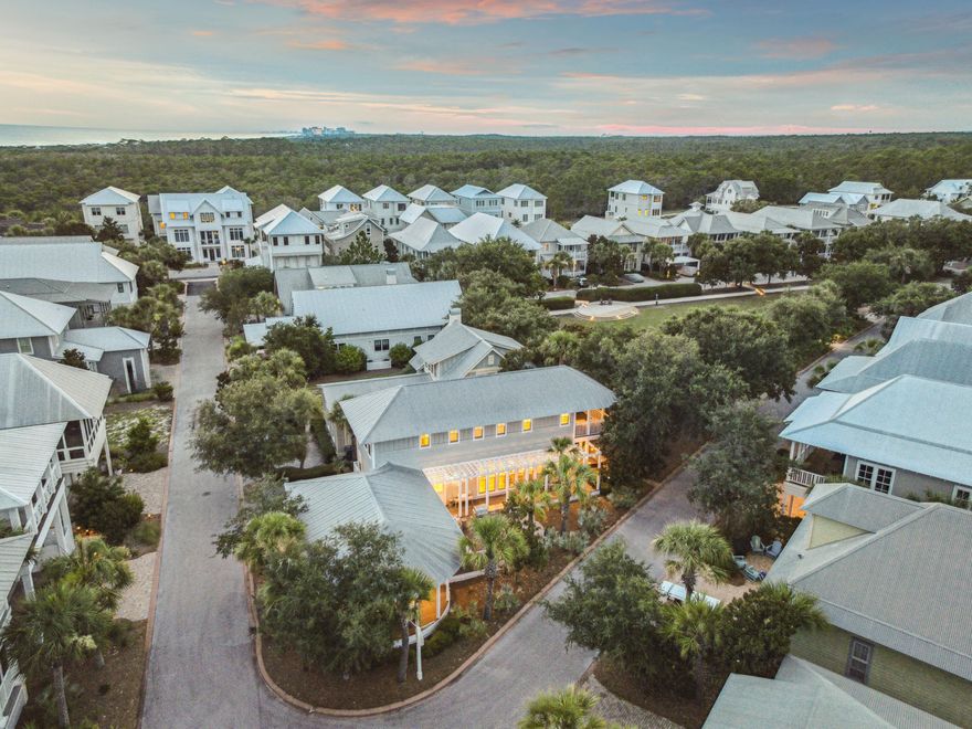 Nestled on a verdant park corner in the coveted Cypress Dunes community, this stunning fully furnished, light-filled residence offers three bedrooms and three and one-half bathrooms. Gleaming hardwood floors span the main living areas, while multiple porches and patios provide seamless indoor-outdoor living. The chef's kitchen has been thoughtfully updated with new countertops and backsplash. A generously sized island with a breakfast bar anchors the space, perfect for both casual gatherings and gourmet entertaining. An open layout connects the kitchen, dining, and living areas, all bathed in natural light. From the living room, French doors open to a shaded back porch overlooking the parkideal for morning coffee or evening cocktails.

On the main level, the primary bedroom occupies its own private wing and boasts a bay-window sitting area, a dedicated porch, and an en-suite bathroom complete with an oversized soaking tub and separate glass-enclosed shower. Upstairs, a second primary bedroom enjoys its own porch and park views, while the third bedroom also offers an en-suite bath for added convenience. A laundry room tucked off the kitchen keeps everyday tasks out of sight.

Residents of Cypress Dunes enjoy gated access, direct proximity to Topsail Beach State Park, a resort-style pool with panoramic gulf vistas, a fully equipped fitness center, and tennis courtsluxury amenities designed to elevate coastal living.