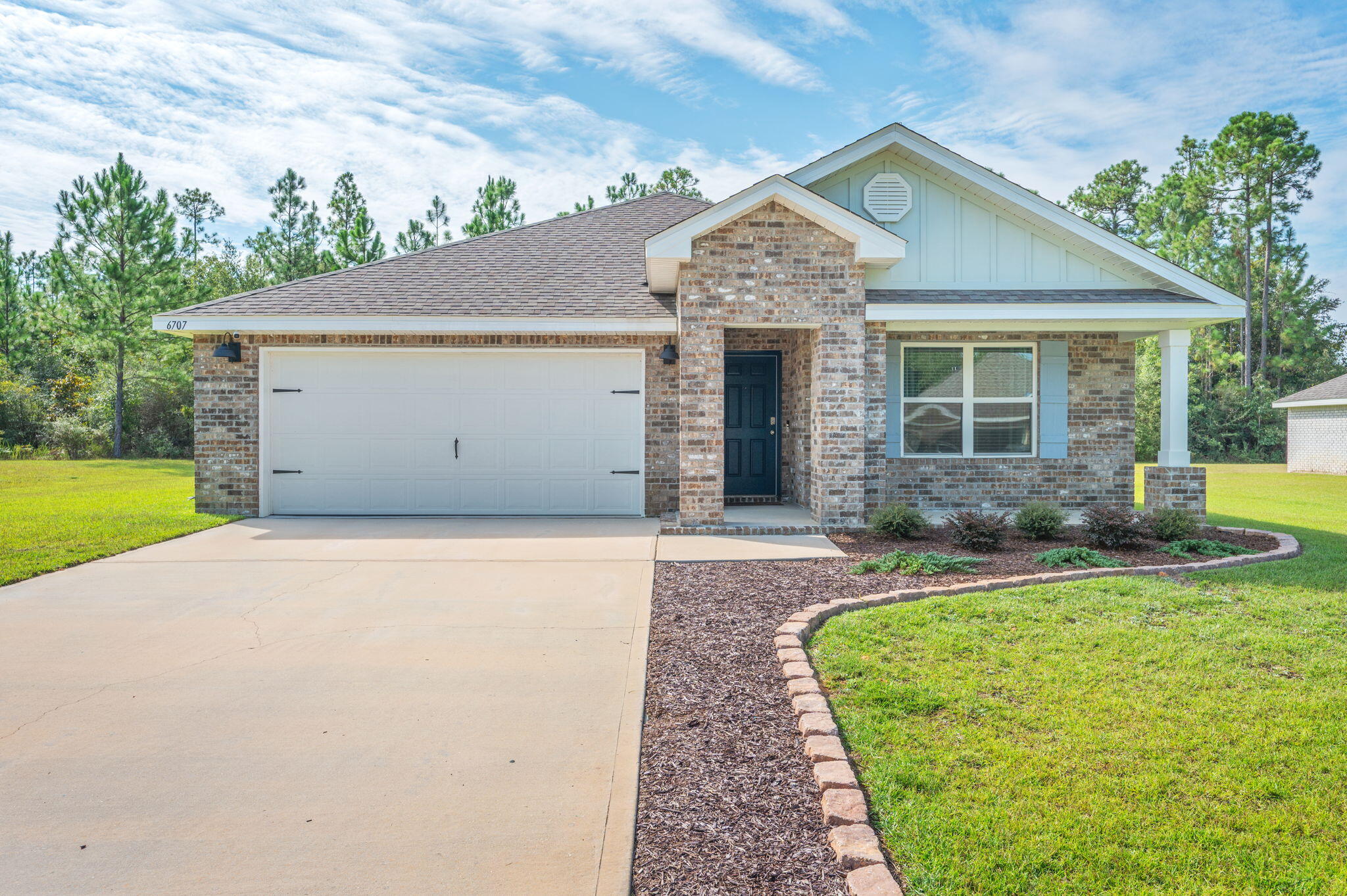 Stop the car and look no farther this 4 bedroom, 2 bath all-brick home built in 2022 is the true definition of Move-In-Ready. From the moment you arrive, you'll notice the beautiful landscaping, spacious .4 acre lot, and charming covered front porch that sets the tone for what's inside. Step through the door and fall in love with the layout, designed for effortless entertaining and everyday living. The bright and spacious living area flows seamlessly into the kitchen and dining space, making this home perfect for gatherings with family and friends. The split-bedroom floor plan provides privacy, with a relaxing primary suite. Three additional bedrooms offer plenty of space for guests, family, or a home office.Outside, enjoy the covered back porch overlooking your backyard- a great place for morning coffee or summer barbecues. This beautiful community offers a lifestyle you'll love, with sidewalks, walking trails, and a large community pool. All of this, located only minutes from the North side of Crestview.