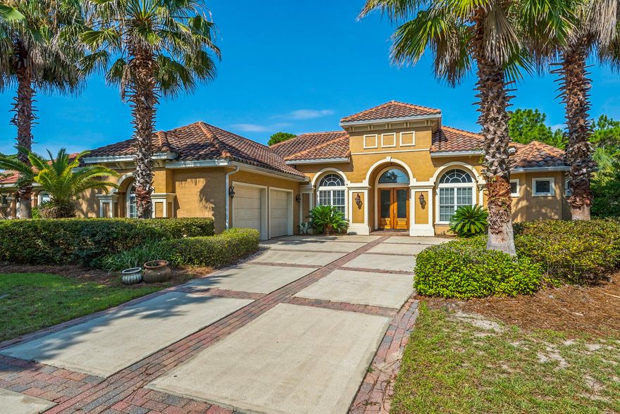 Luxurious family living all on one level in the esteemed gated golf community of Regatta Bay. This 5-bedroom lakefront home is carefully planned with large family gathering spaces as well as areas for privacy including two home offices and a separate formal living room. The screen-in lanai overlooking the lake ties the whole home together through multiple access points throughout. The kitchen holds the hallmarks of a gourmet kitchen: granite countertops, stainless steel appliances, gas cooktop, wine refrigerator, warming drawer, generous workspace, breakfast bar, and center island. The master suite is a peaceful respite with lake views, private office, two closets, and an inviting master bath with separate granite topped vanities, garden tub, and large walk-in shower. Two of the four guest bedrooms are united by a jack-n-jill bath. This home's earthy, meditative tones highlight views of the bright blue waters of the lake, while large windows allow natural light to reach deep within the interior. Additional notable features include a formal study with built-in bookshelves and cabinetry, Travertine floors, trey ceilings, and a sprawling backyard with room for a swimming pool. Located in a 120-acre nature preserve, Regatta Bay is an exclusive residential community with gated entrance, tennis, swimming, boating, golf, dining, and more. Destin Commons, Lulu's, and the marina are just a short golf cart ride away. This beautiful home is a must-see! Buyer to verify all dimensions and fees.