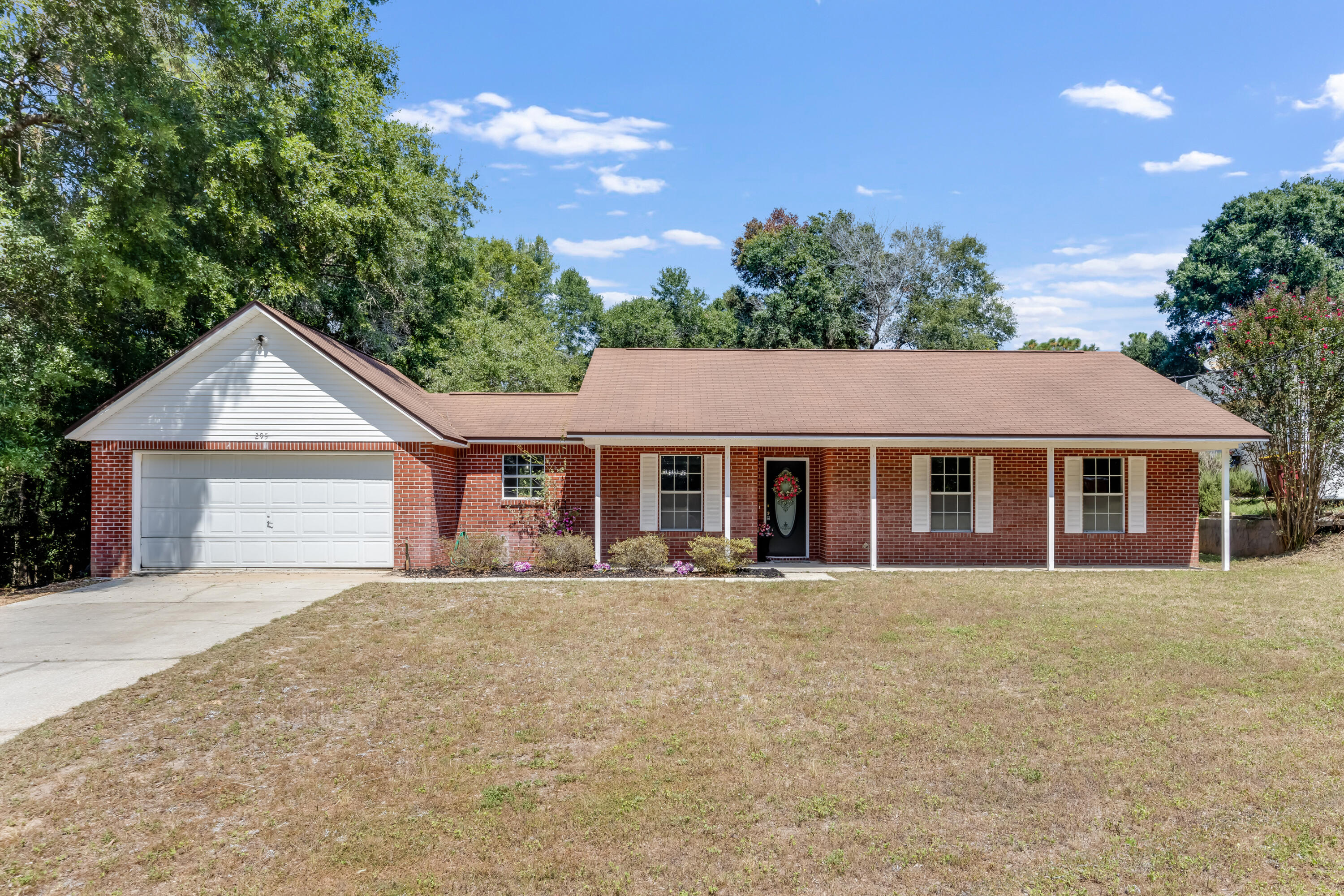 Sitting on almost half an acre in the heart of Crestview.This gorgeous home was recently refreshed with brand new countertops, new flooring, new paint, new faucets, new appliances. Built in Fireplace.Brand New Water Heater. Sellers will install a new roof at closing.