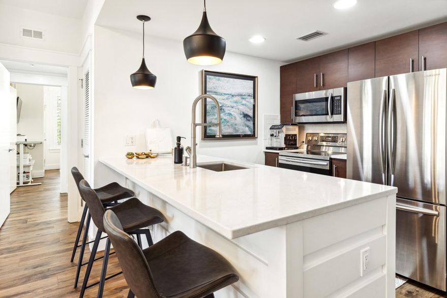 *Buy before Nov 30, 2025 to take advantage of this Buyer Incentive! Seller offering a credit of 1 year Elation Condo Dues* Updated & Upscale | Ground Floor Resort Retreat! Fully renovated and turn-key, this ground-floor corner resort condo in Sandestin Golf and Beach Resort offers stunning lake and golf course views from a private patio.  Designed in a modern coastal style, it features LVP flooring, designer furnishings including an Arhaus sectional, and 4.5'' plantation shutters. The sleek kitchen shines with white marble quartz, cherry cabinets, stainless appliances, and a custom breakfast bar. Spa-like bath with dual vanity and frameless glass shower. Spacious bedroom with West Elm king storage bed. Turn-key and rental-ready, this gorgeous remodel is sure to exceed guest expectations. Elation residents enjoy access to the Solstice Club, the Grand Complex pool, hot tub and kiddie pool, and the Grand Sandestin fitness center. Elation is also conveniently located next to Hotel Effie and the dining, shopping, and live entertainment of the Village.

As an introduction to the Sandestin lifestyle, we invite our new owners to explore amenities that make Sandestin special. The listing brokerage and seller(s) are presenting the buyer(s) of this property with (2) 90-minute rounds of Tennis court time, a golf foursome at one of our three championship courses, and a round of golf for up to four (4) players at the unrivaled Burnt Pine Golf Club.

Sandestin Golf and Beach Resort features more than seven miles of beaches and pristine bay front, four championship golf courses, 15 world-class tennis courts, a 226-slip marina, a fitness center, spa and celebrity chef dining. Shop, dine and play at the charming pedestrian village, The Village of Baytowne Wharf and more. Inside the gates of the resort, residents enjoy a balanced lifestyle of high-class living, spanning the 2,400 acres from the beach to the bay. Everything within the gates of the resort is accessible by golf cart or bicycle. The entire resort is interconnected by miles of pedestrian, bike and golf cart paths that weave through groves of live oaks, meandering past natural lagoons, fountains, man-made lakes, and meticulously landscaped fairways.