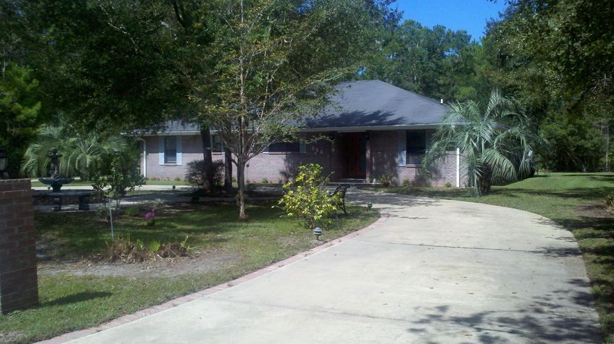 CUSTOM BRICK HOME with Double Double Garages! Inviting Saltwater Pool with screen enclosure perfect for entertaining. Great room with oversized kitchen. Tile throughout for easy care. Split bedroom plan with generous sized master suite. Two guest bedrooms with hall bath between. Separate office with outside entrance could easily be converted to a 4th bedroom. Freshly painted interior in August 2014. Beautiful landscaping with fountain feature in the front yard surrounded by pinto and sago palms. Circular driveway with brick curbing & accents. One garage is heated & cooled and one garage is a workshop. Well built home with nice upgrades. This is one to see!