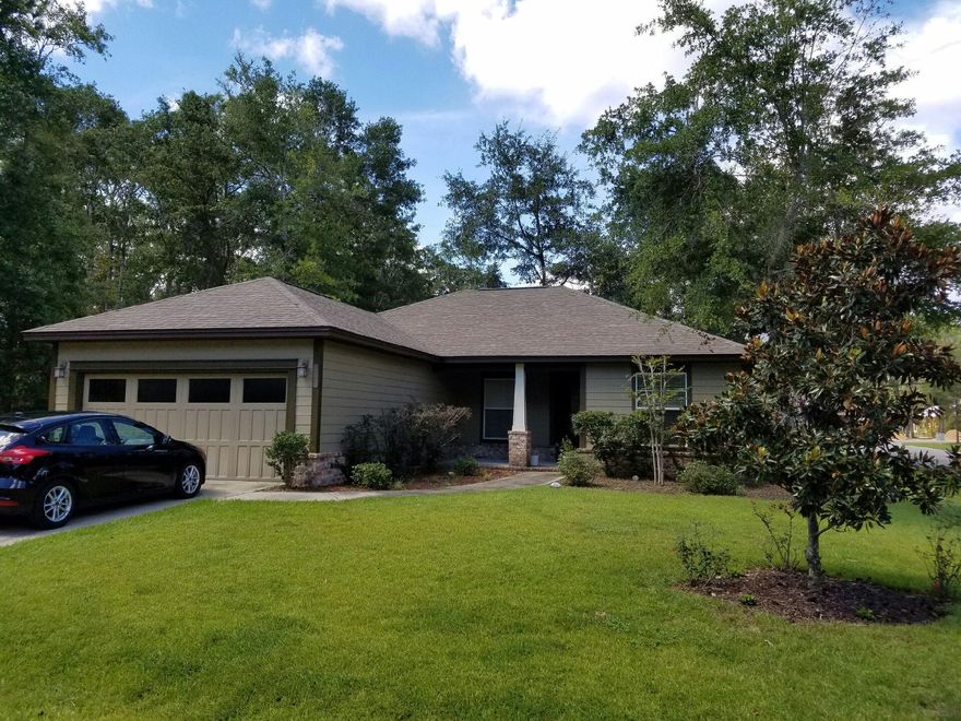 Welcome to The Canopies of Freeport, a small family friendly community just minutes to The Beaches of South Walton. Tucked away beneath the scrub oaks and magnolias are traditional homes built with attention to detail.Open floor plan consisting of 3 bedrooms, 2 baths, 1,488 sf,covered front porch, covered back patio,yard sprinkler system, privacy fenced back yard, & a 2 car garage.Well maintained inside and out this Craftsman Style home has many stylish upgrades including modern fans, tile floors in the living, kitchen, baths, and laundry areas, chandelier above the kitchen table and pendent lighting above the breakfast bar. The kitchen boasts upgraded cabinets, granite counter tops, under mount sink, andstainless steel appliances.