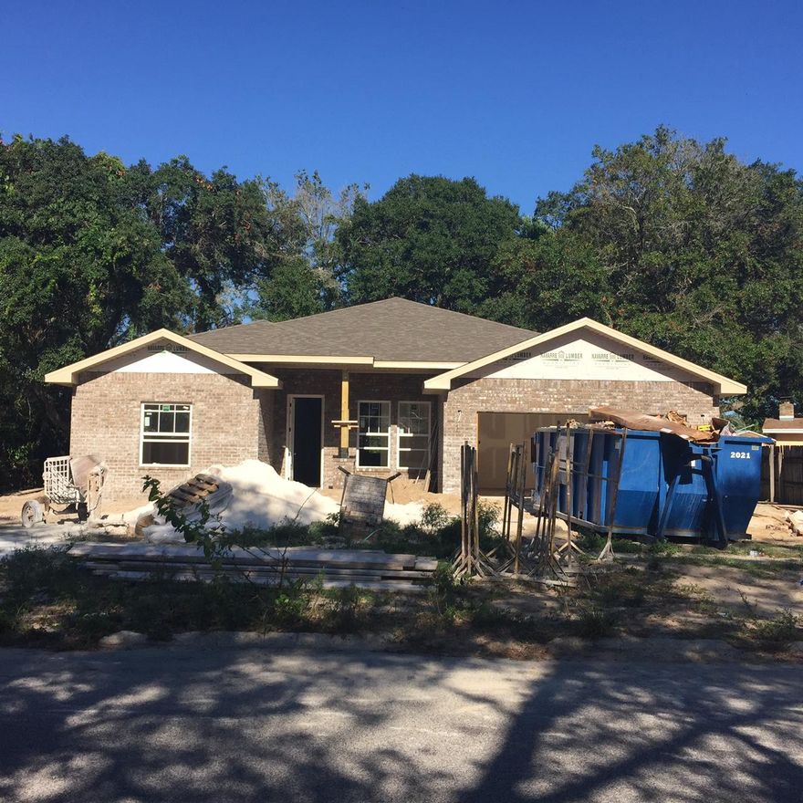 Great location with large yard. This 4/3 custom brick home has super curb appeal. There are 10 Ft. Ceilings w/ impressive crown molding, will have 'wood look'' tile looring, and 5 1/4'' baseboard throughout the main living areas. As you enter the home through the covered front porch, the formal dining room is on your right. As you continue down the hallway, you will then enter the chef's delight kitchen which will boast custom Espresso colored cabinetry, granite countertops, 2 large pantry's, and stainless appliances (including an oversized commercial grade frig./freezer). This plan is a split bedroom, where bedrooms 1 - 3, and baths 1 and 2, are located at the left of the home. The master suite is in the right rear of the home, is very roomy, has 2 large walk - in closets, a custom tiled walk - in shower with class enclosure, a whirlpool garden tub, a double vanity and a linen closet. The laundry room is conveniently located at the rear of the kitchen. The oversized greatroom is located at the front of the kitchen, and opens to a covered porch, which is perfect for entertaining. The yard will be beautifully landscaped, have a privacy fence, and comes complete w/ a well, sprinkler system and timer. Insurance will be very reasonable, as home is built to today's code. Completion is expected in late September..