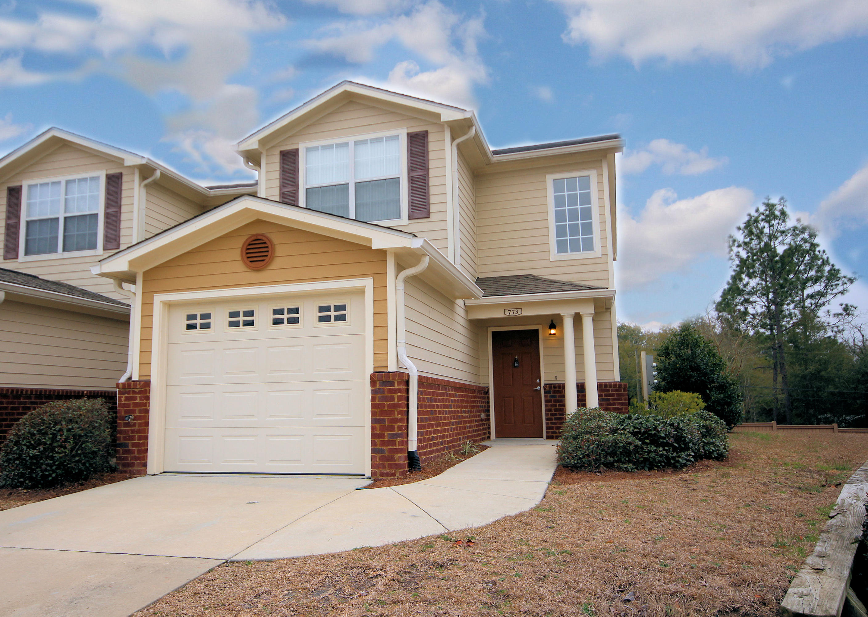 Buyer home warranty offered! This 1264 sq foot, 2 bedroom/2.5 bath townhome is located in the Desirable Eagles Landing Subdivision, South of I10 and convenient to 7th Special Forces/Duke Field! The unit has brick and Hardiplank siding on the exterior with newly powerwashed walkways and driveway! The interior walls have been newly painted and the carpet cleaned! The owner has added a security system, new dishwasher (2014), new A/C evaporator coil (2014), new garbage disposal (2014), upgraded the kitchen faucet (2015), and installed a new enclosed blinds on the patio door (2015). The kitchen offers a built-in microwave, a stove, and a side by side refrigerator with icemaker and water dispenser. The kitchen opens