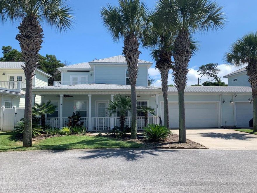 Miramar Palms is located 21/2 blocks from the beach! Looking for a vacation investment property that still feels like home?  This is your place. All floors have hard finishes.1st floor Master bedroom with beautifully tiled shower. 1st floor powder room conveniently located just off the kitchen.  Hardwood floors lead you upstairs to 2 generously sized guest bedrooms.  One of which has French doors that lead to an exterior patio overlooking the community.Hardi-plank siding, metal roof, oversized double garage, covered front, plus a back patio with a fenced in yard and an outdoor shower.   This home is being sold fully furnished with only one painting and one armoire excluded. Smart wall switches, Ring doorbell, and Schlage digital front door lock included with purchase.