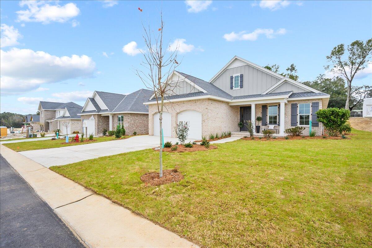 Mustang plan built by a premier builder in our area, just minutes from Eglin AFB, top rated schools and the beaches of Destin. Gorgeous interior features include an open concept floor plan, 8' doorways throughout, LVP and tile flooring, granite or quartz counter tops, Legacy cabinetry w/soft hinges and drawers, stainless steel appliances, tankless gas hot water heater, and much more! Full landscaping and irrigation included, along with screened porch. Pictures are of similar home. More plans and lots available. Call or text today for more information! Buyer to verify all deemed important information.