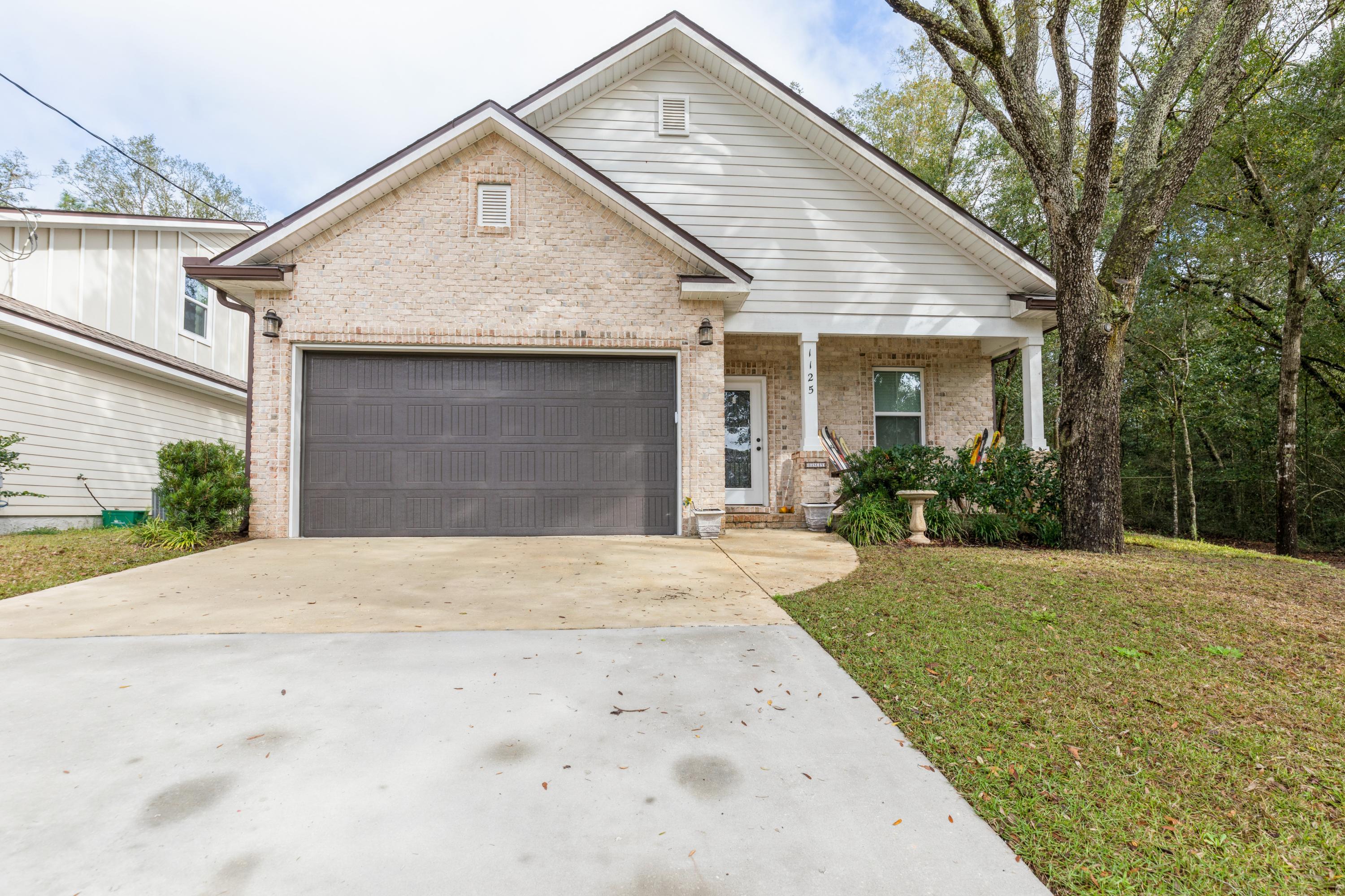 Beautiful home on a one way street in the heart of Niceville. This nearly new home has a great floor plan with tons of storage space. French doors from the master bedroom lead to a covered porch overlooking the private backyard. The master bath has a large tiled shower with double heads and a bench, double vanities and a private toilet room. There are three bedrooms and a full bath upstairs. There is an office/study W/walk-in closet, can be A 5th bedroom located downstairs. The kitchen boasts stainless steel appliances, granite countertops throughout the home, custom cabinets SOFT close drawers, two large pantries and a large breakfast bar opening to the large dining and family area. Hardwood floors in the family room and office, custom tile in the kitchen, halls and bathrooms.
