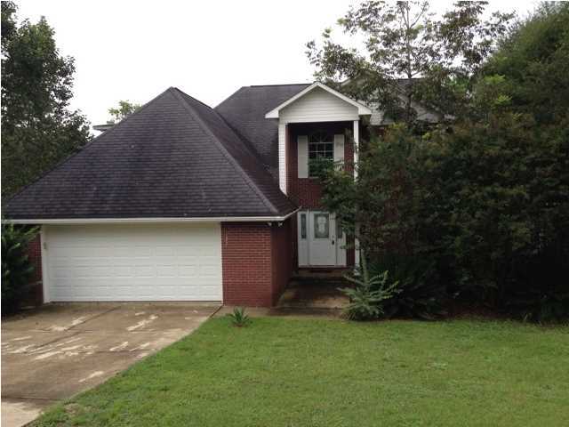 ''Fishing Allowed''. Walk out your back door down to water's edge and throw in a fishing line. Home offers places for entertaining and fun. The two-story ceiling in the living room give a spacious but cozy feel. Tall ceilings in the living room. Eat-in kitchen with tiled countertops, tile flooring and stainless steel appliances is a cook's dream. The extra large laundry room offers lots and lots of storage. The down stairs master suite features a 15X15 bedrooms and a bath with separate shower, whirlpool tub, and double vanities. A guest bath is located in foyer area as you walk into the home. Enjoy the Florida Room that overlooks the multi level decking. Home is being sold in ''AS IS'' condition.