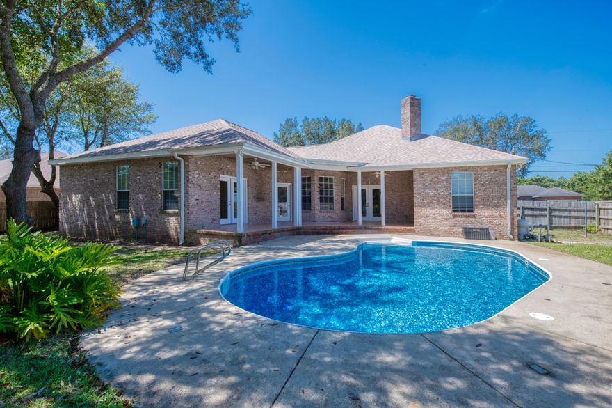 Beautiful Custom built Pool home in HBTS. Have piece of mind as this home is built w/ICF (Insulated Concrete Forms) construction. Home offers underground utilities, & has 6'' block exterior walls. As you walk up the winding paver sidewalk you will notice a large front porch w/ beautiful cypress wood ceiling, & a large Oak tree offering shade on the front lawn. Home has soaring 9'4 ceilings throughout interior, and 11' ceilings in garage. Large fully fenced backyard w/an inground pool, liner & pool pump only 2 years old, & pool filters have just been replaced. New dimensional shingle roof in 2017. Living room has plenty of room for your furniture & includes a beautiful refinished fireplace, & French doors leading out to a large back porch w/cypress ceilings, & then out to your pool. Kitchen includes solid surface counter tops, & solid oak cabinets.  Kitchen has a large eat in area in addition to a formal dining room.  Just off of the kitchen is a nice size butlers pantry leading into a large laundry room.  Master suite has doors that lead out to the back porch. Master bath features separate shower, jetted tub, and walk-in closets. On the other side of the home is 2 nice size bedrooms and guest bathroom.  Plenty of parking for everyone with an extra wide driveway.
