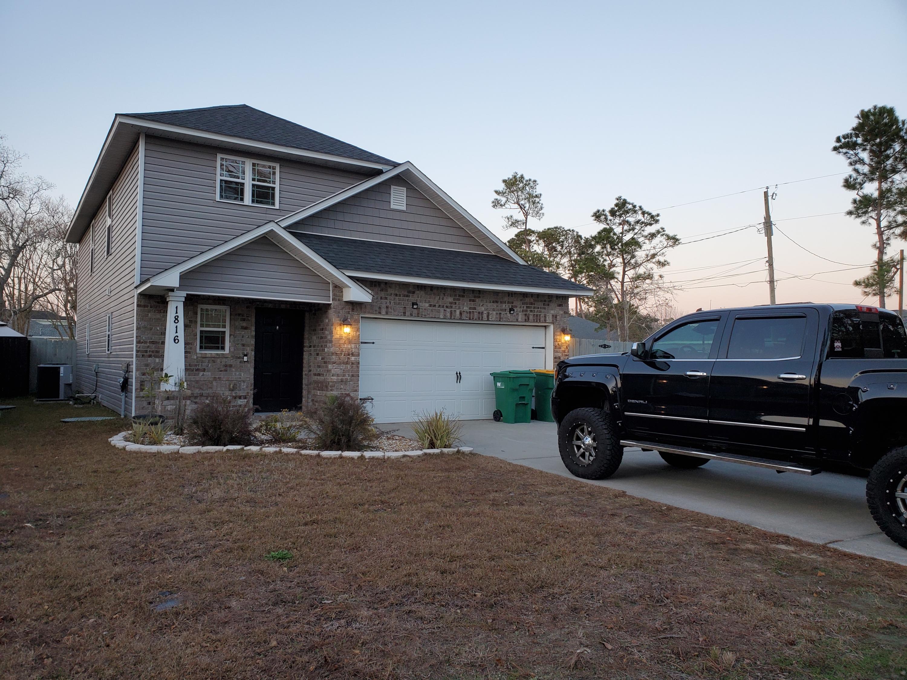 Back on the market. See the Santa Rosa Sound from the upstairs of this awesome home. Sits on a corner lot and has an open floor plan. There is a loft that overlooks the living/dining room and beautiful laminate wood floors. Well laid-out kitchen features granite counter tops, stainless steel refrigerator, smooth-top stove. LOTS of cabinets and a walk-in pantry. Large master bedroom is downstairs and has large walk-in closet and bathroom with double vanity and garden tub. Half bath downstairs and indoor laundry room. Also has a security system (not monitored). Plenty of shelving in garage. Ready for you to move in today!